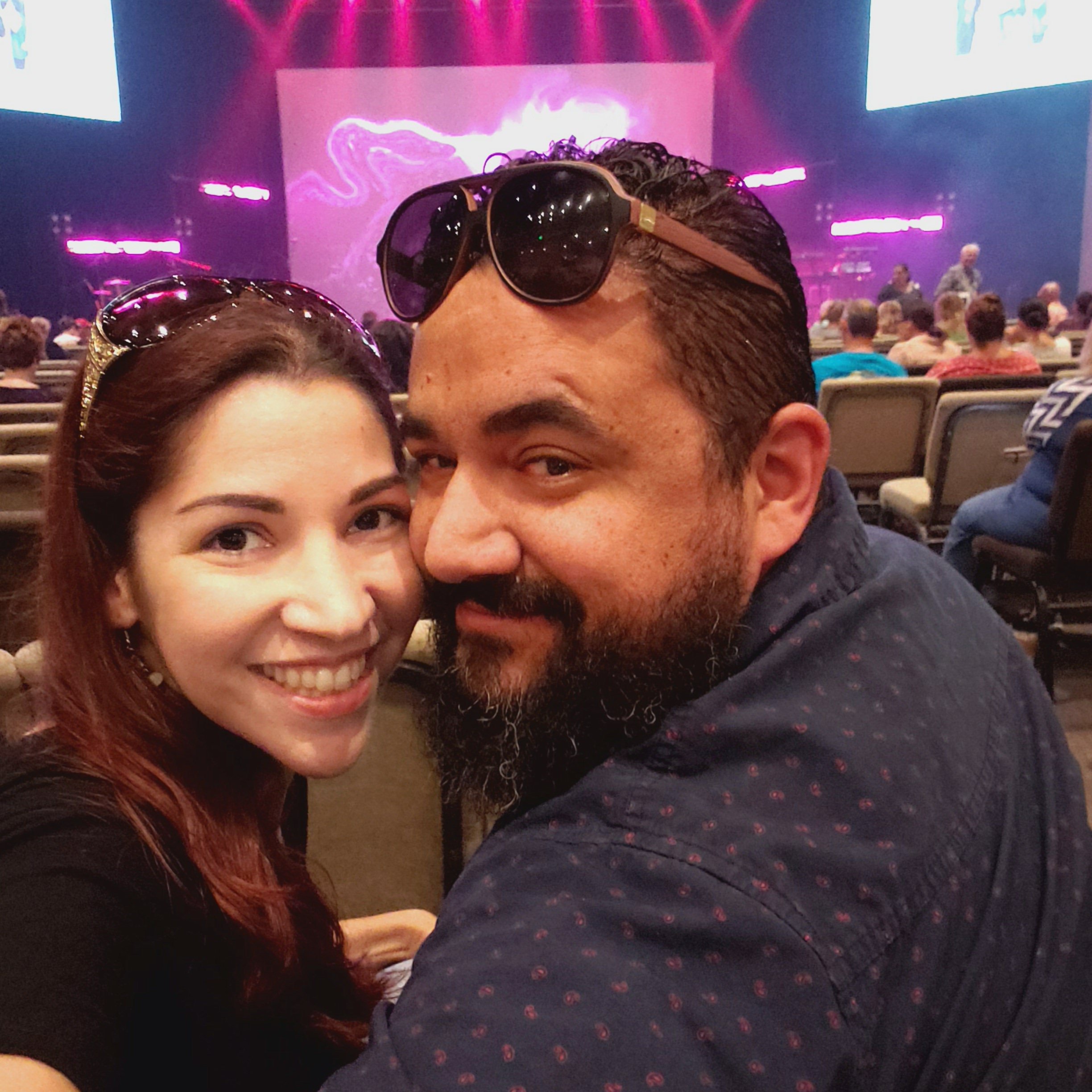 My hubby and I in church, smiling, ready for worship!